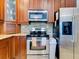 Well-equipped kitchen featuring stainless steel appliances and granite countertops at 12211 Oak Ramble Dr, Spring Hill, FL 34610
