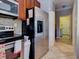 Kitchen boasts stainless steel appliances and an adjacent laundry room at 12211 Oak Ramble Dr, Spring Hill, FL 34610