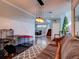 Spacious living room with hardwood floors, staircase, and Christmas tree at 12211 Oak Ramble Dr, Spring Hill, FL 34610