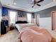 Main bedroom with a king-size bed and plenty of natural light at 12211 Oak Ramble Dr, Spring Hill, FL 34610