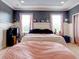 Main bedroom with a king-size bed and plenty of natural light at 12211 Oak Ramble Dr, Spring Hill, FL 34610