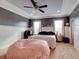 Main bedroom with a king-size bed and plenty of natural light at 12211 Oak Ramble Dr, Spring Hill, FL 34610