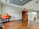 Home office with hardwood floors and built-in shelving at 12211 Oak Ramble Dr, Spring Hill, FL 34610