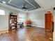 Home office with hardwood floors, built-in shelving and window at 12211 Oak Ramble Dr, Spring Hill, FL 34610