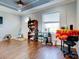 Home office with hardwood floors, built-in shelving and window at 12211 Oak Ramble Dr, Spring Hill, FL 34610