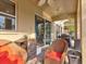 Relaxing patio with wicker chairs and access to a pool at 12211 Oak Ramble Dr, Spring Hill, FL 34610