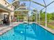 Refreshing pool with screened enclosure and spa at 12211 Oak Ramble Dr, Spring Hill, FL 34610