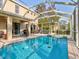 Relaxing pool and spa with screened enclosure at 12211 Oak Ramble Dr, Spring Hill, FL 34610