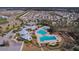 Community pool and clubhouse with surrounding homes at 12931 Twin Bridges Dr, Riverview, FL 33579