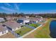 Community overview with lake and homes at 12931 Twin Bridges Dr, Riverview, FL 33579