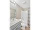 Bathroom with a single vanity, tub and shower at 12931 Twin Bridges Dr, Riverview, FL 33579