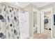 Bathroom with shower, toilet and access to a walk-in closet at 12931 Twin Bridges Dr, Riverview, FL 33579