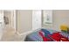 Bedroom with twin bed, and access to a shared hallway at 12931 Twin Bridges Dr, Riverview, FL 33579