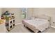 Charming bedroom with a queen-size bed and playful decor at 12931 Twin Bridges Dr, Riverview, FL 33579