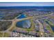 Aerial view of community with lake and homes at 12931 Twin Bridges Dr, Riverview, FL 33579