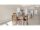 Bright dining room with a wooden table and chairs near the kitchen at 12931 Twin Bridges Dr, Riverview, FL 33579