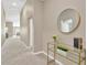 Hallway with carpeted floors and a gold framed mirror at 12931 Twin Bridges Dr, Riverview, FL 33579
