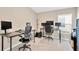 Bright home office features two desks, window light, and ample space at 12931 Twin Bridges Dr, Riverview, FL 33579