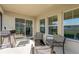 Relaxing patio with seating area and grill at 12931 Twin Bridges Dr, Riverview, FL 33579