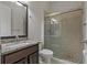 Bathroom boasts granite countertop and a walk-in shower at 1317 Lorea Ln, Brandon, FL 33511