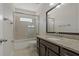Bathroom with tub, shower, and granite vanity at 1317 Lorea Ln, Brandon, FL 33511