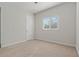 Bright bedroom featuring neutral walls and carpet at 1317 Lorea Ln, Brandon, FL 33511