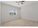 Spacious bedroom with window and ceiling fan at 1317 Lorea Ln, Brandon, FL 33511