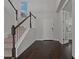 Two-story entryway with dark hardwood floors and staircase at 1317 Lorea Ln, Brandon, FL 33511