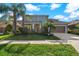 Two-story house with a brown garage door and landscaping at 1317 Lorea Ln, Brandon, FL 33511