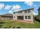 Two-story house with backyard patio and screened enclosure at 1317 Lorea Ln, Brandon, FL 33511