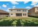 Two-story house with backyard patio and screened enclosure at 1317 Lorea Ln, Brandon, FL 33511