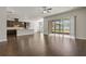 Open kitchen with island, stainless steel appliances, and dark wood cabinets at 1317 Lorea Ln, Brandon, FL 33511