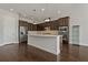 Modern kitchen with dark wood cabinets and island at 1317 Lorea Ln, Brandon, FL 33511