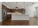 Modern kitchen with dark cabinets and an island at 1317 Lorea Ln, Brandon, FL 33511