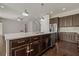 Island kitchen with stainless steel appliances and granite countertops at 1317 Lorea Ln, Brandon, FL 33511
