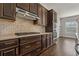 Kitchen with gas cooktop, stainless steel appliances, and custom cabinetry at 1317 Lorea Ln, Brandon, FL 33511
