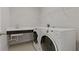 Laundry room with washer, dryer, and utility sink at 1317 Lorea Ln, Brandon, FL 33511