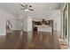Open living room with hardwood floors and kitchen access at 1317 Lorea Ln, Brandon, FL 33511
