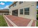 Red paver patio with screened enclosure attached to house at 1317 Lorea Ln, Brandon, FL 33511