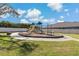 Community playground with playset and benches at 1317 Lorea Ln, Brandon, FL 33511