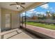 Screened porch with view of backyard and sliding glass door at 1317 Lorea Ln, Brandon, FL 33511