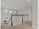 Upstairs hallway with carpet and views to the first floor at 1317 Lorea Ln, Brandon, FL 33511