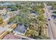Aerial view of a single story home on a tree lined street at 13214 Moran Dr, Tampa, FL 33618