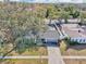 Attractive single-story house with a large yard, seen from above at 13214 Moran Dr, Tampa, FL 33618