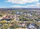Wide aerial showcasing a neighborhood near a lake and city skyline at 13214 Moran Dr, Tampa, FL 33618