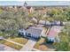 Single-story home with a gray roof and red door, aerial view at 13214 Moran Dr, Tampa, FL 33618