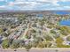Neighborhood overview with houses, trees, and a lake at 13214 Moran Dr, Tampa, FL 33618