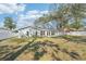 Home features a large backyard with mature trees at 13214 Moran Dr, Tampa, FL 33618