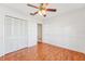 Well-lit bedroom with hardwood floors and closet at 13214 Moran Dr, Tampa, FL 33618