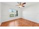 Bright bedroom featuring hardwood floors and a window at 13214 Moran Dr, Tampa, FL 33618